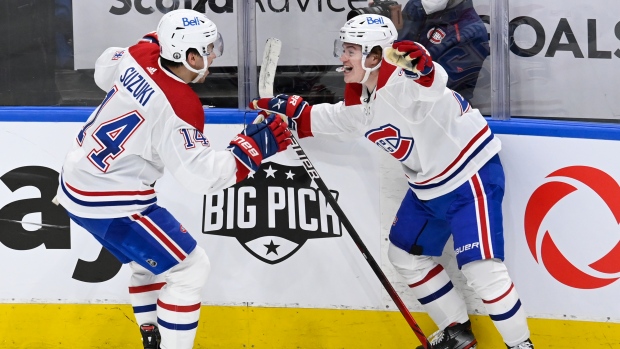Nick Suzuki, Cole Caufield, The Canadian Press Nick Suzuki, Cole Caufield