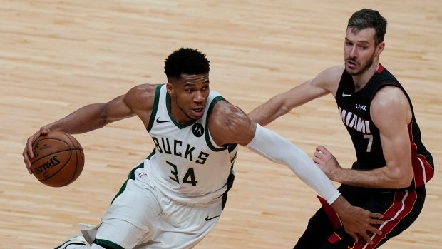 Giannis Antetokounmpo (34) and Goran Dragic (7)