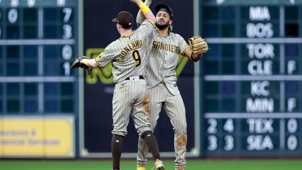 Jake Cronenworth (9) and Fernando Tatis Jr. celebrate, The Canadian Press Jake Cronenworth (9) and Fernando Tatis Jr. celebrate
