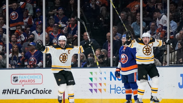 Boston Bruins' Patrice Bergeron, left, and Brad Marchand, right, celebrate