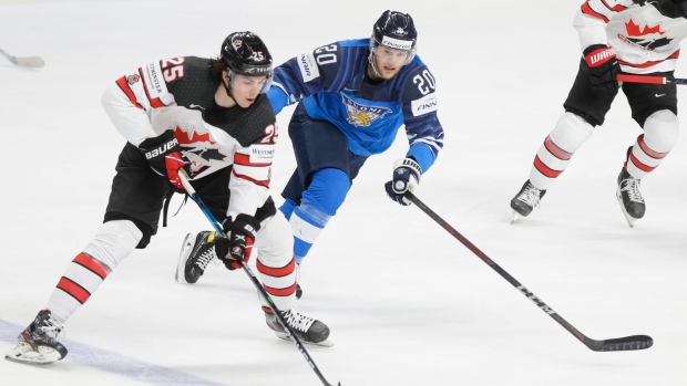 Canada's Owen Power and Finland's Niko Ojamaki, The Canadian Press Canada's Owen Power and Finland's Niko Ojamaki