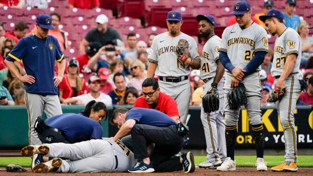 Travis Shaw is attended to following his injury