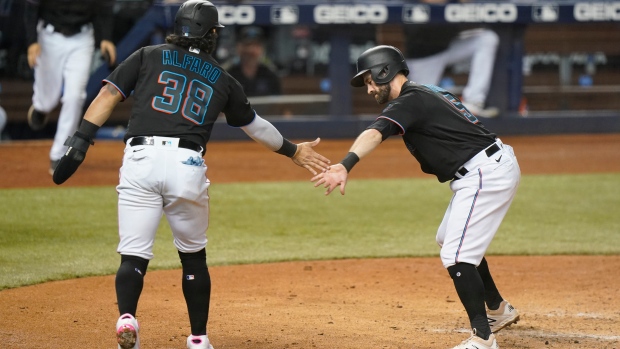 Jorge Alfaro (38) and Jon Berti (5)