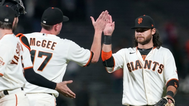 Jake McGee and Brandon Crawford , The Canadian Press Jake McGee and Brandon Crawford
