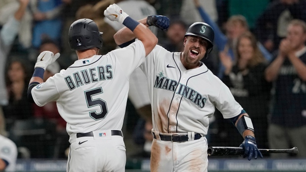 Seattle Mariners' Jake Bauers and Tom Murphy , The Canadian Press Seattle Mariners' Jake Bauers and Tom Murphy