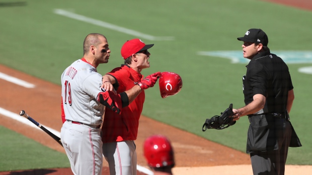 Joey Votto (19) is held back by manager David Bell, The Canadian Press Joey Votto (19) is held back by manager David Bell
