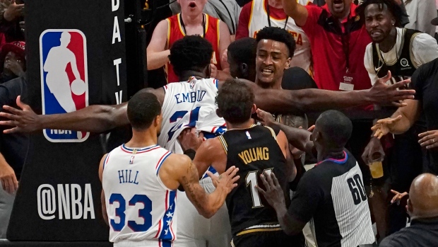 Joel Embiid John Collins, The Canadian Press Joel Embiid John Collins