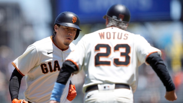 Wilmer Flores and Ron Wotus celebrate, The Canadian Press Wilmer Flores and Ron Wotus celebrate