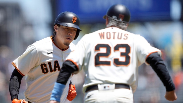 Wilmer Flores and Ron Wotus celebrate