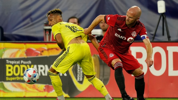 Hany Mukhtar, Michael Bradley, The Canadian Press Hany Mukhtar, Michael Bradley