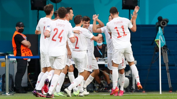 Spain celebrates Swiss own goal, The Canadian Press Spain celebrates Swiss own goal