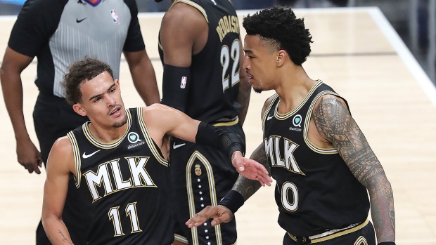 Trae Young John Collins, The Canadian Press Trae Young John Collins