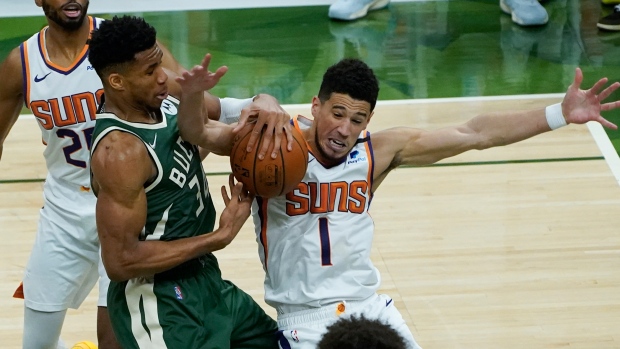 Giannis Antetokounmpo, Devin Booker, The Canadian Press Giannis Antetokounmpo, Devin Booker