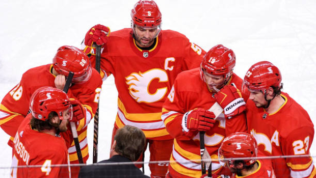 Calgary Flames gather at bench during timeout