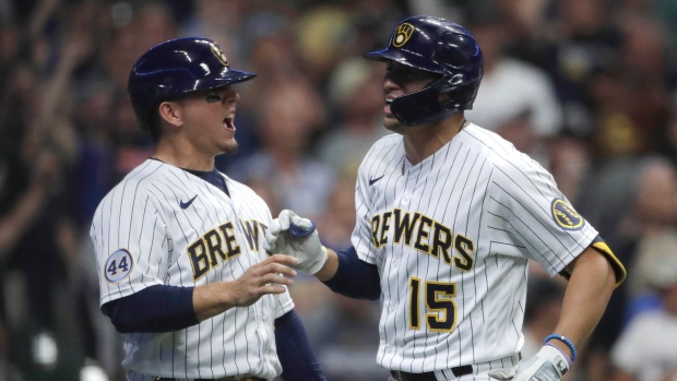 Tyrone Taylor, Luis Urias, The Canadian Press Tyrone Taylor, Luis Urias
