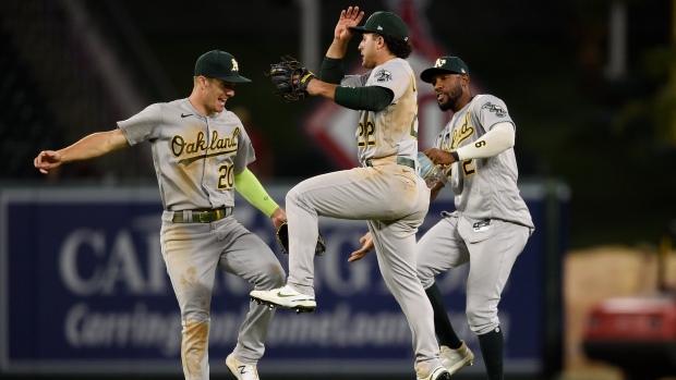 Mark Canha, Ramon Laureano, Starling Marte, The Canadian Press Mark Canha, Ramon Laureano, Starling Marte