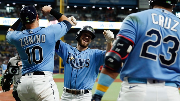Brandon Lowe, Mike Zunino, Nelson Cruz, The Canadian Press Brandon Lowe, Mike Zunino, Nelson Cruz