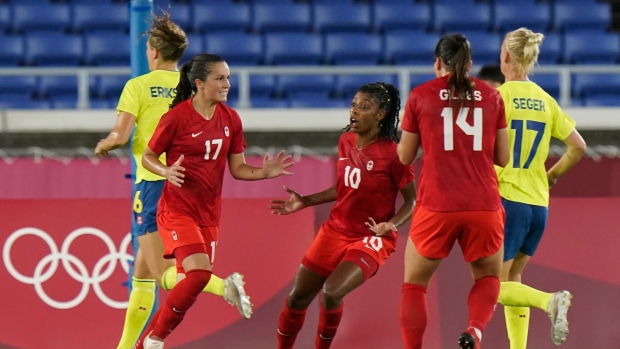 Jessie Fleming celebrates