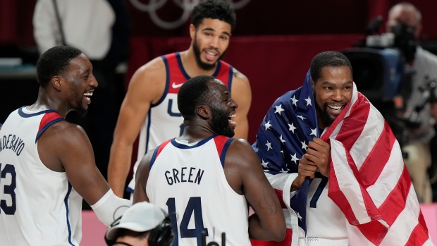 Team USA celebrates, The Canadian Press Team USA celebrates