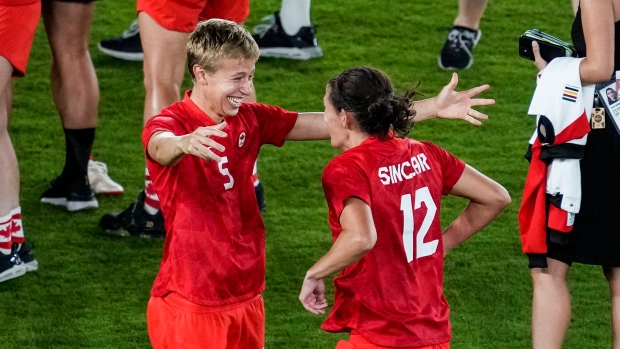 Quinn Christine Sinclair , The Canadian Press Quinn Christine Sinclair