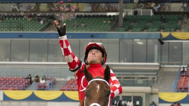 Justin Stein aboard Munnyfor Ro after winning the Woodbine Oaks