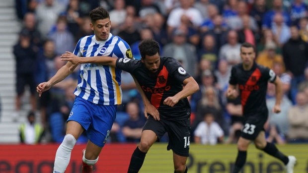 Jakub Moder, left, Andros Townsend