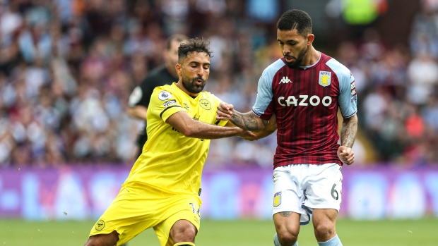 Saman Ghoddos, left, and Douglas Luiz