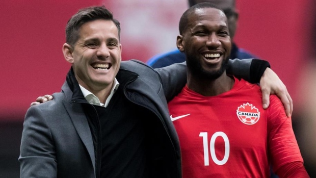 Team Canada head coach John Herdman (left)