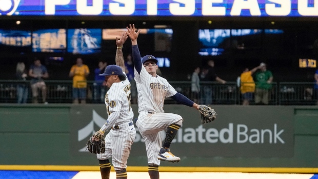 Kolten Wong Luis Urias, The Canadian Press Kolten Wong Luis Urias