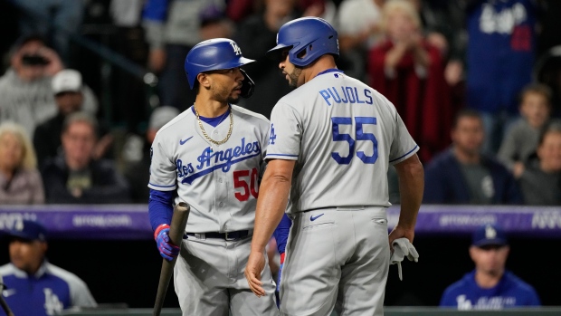 Mookie Betts, Albert Pujols, The Canadian Press Mookie Betts, Albert Pujols