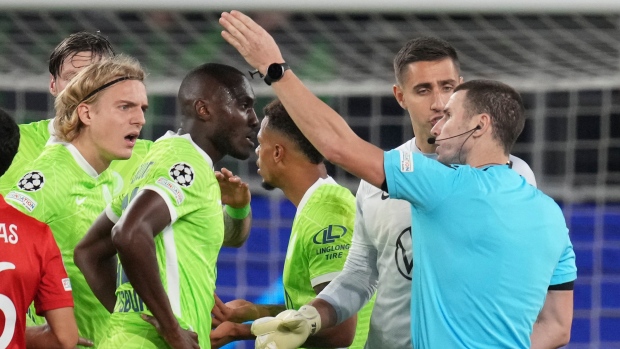 Referee talks to Wolfsburg's Josuha Guilavogui, The Canadian Press Referee talks to Wolfsburg's Josuha Guilavogui