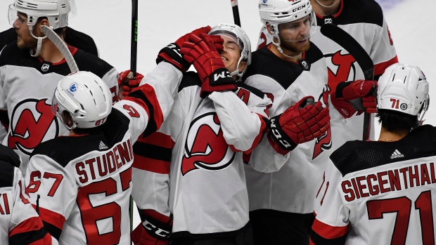 Yegor Sharangovich New Jersey Devils Unsigned White Jersey Skating vs. New  York Islanders Photograph