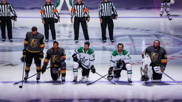 Ryan Reaves, Jason Dickinson, Tyler Seguin and Robin Lehner take a knee during anthem