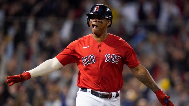 Red Sox 3B Devers practices with teammates on, off field