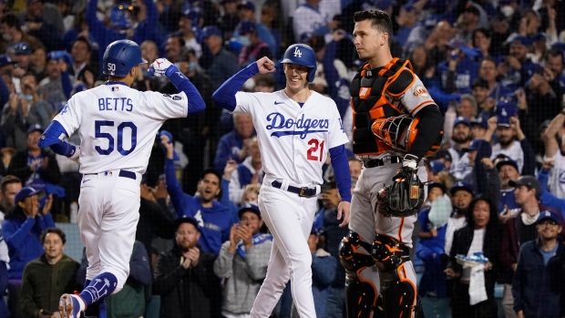 Mookie Betts, Walker Buehler, Buster Posey , The Canadian Press Mookie Betts, Walker Buehler, Buster Posey