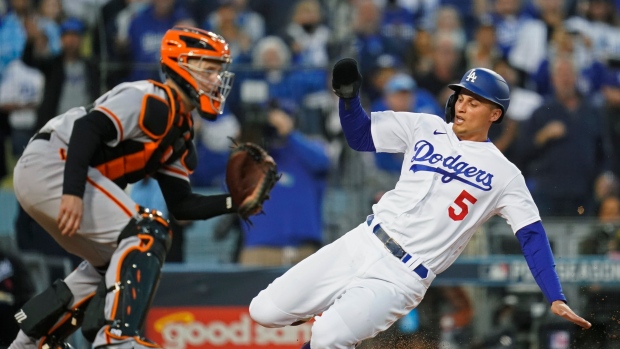 Corey Seager, Buster Posey, The Canadian Press Corey Seager, Buster Posey