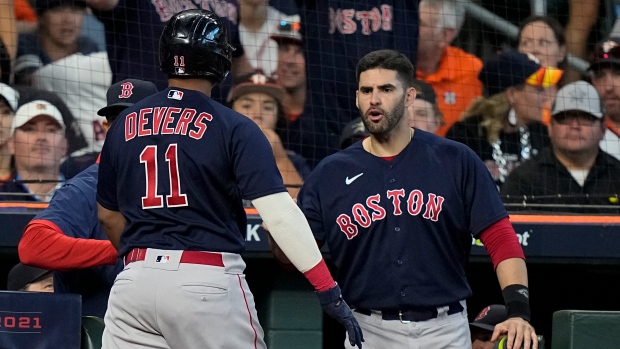 Rafael Devers and J.D. Martinez , The Canadian Press Rafael Devers and J.D. Martinez
