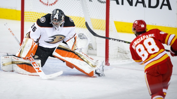 Andrew Mangiapane shoots on John Gibson