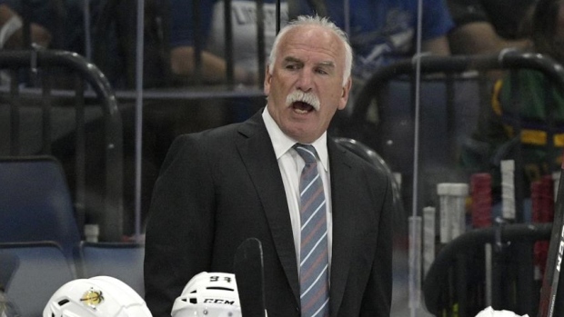 Florida Panthers head coach Joel Quenneville skates during the