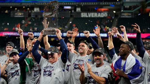 Atlanta Braves celebrate with Commissioner's Trophy