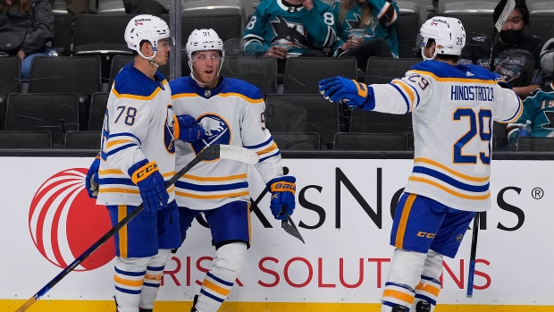 Drake Caggiula celebrates with Jacob Bryson and Vinnie Hinostroza