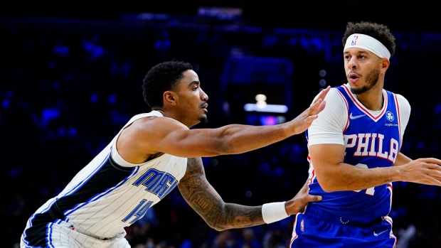 Philadelphia 76ers' Seth Curry and Orlando Magic's Gary Harris , The Canadian Press Philadelphia 76ers' Seth Curry and Orlando Magic's Gary Harris