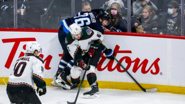 Dysin Mayo checks Blake Wheeler , Getty Images Dysin Mayo checks Blake Wheeler