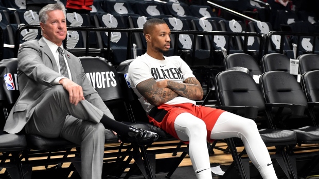 Neil Olshey and Damian Lillard, Steve Dykes/Getty Images Neil Olshey and Damian Lillard