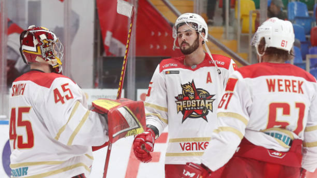 Kunlun Red Star goaltender Jeremy Smith, Ryan Sproul and Ethan Werek, Getty Images Kunlun Red Star goaltender Jeremy Smith, Ryan Sproul and Ethan Werek