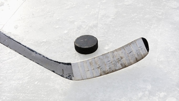 Hockey stick and puck, Getty Images Hockey stick and puck