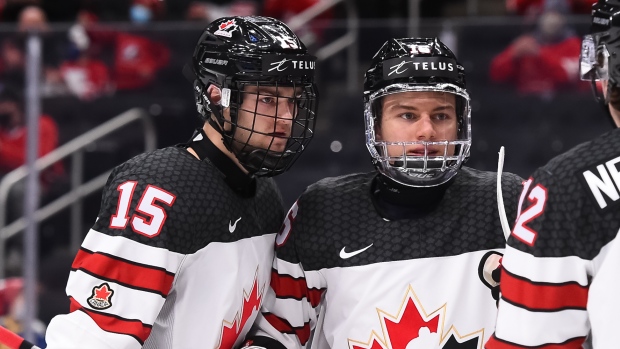 Connor Bedard celebrates with Shane Wright (right) and Jake Neighbours, IIHF/HHOF Connor Bedard celebrates with Shane Wright (right) and Jake Neighbours