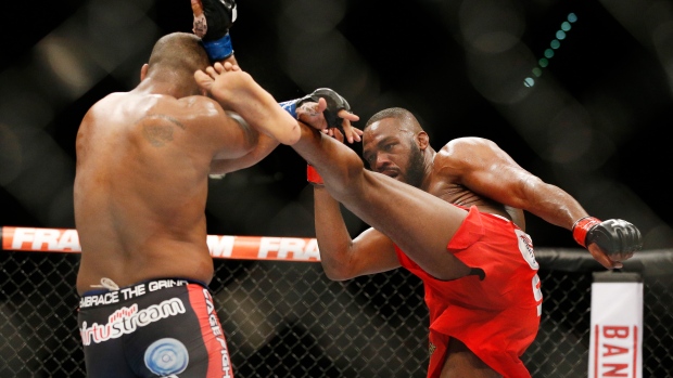 Jon Jones kicks Daniel Cormier, The Canadian Press Jon Jones kicks Daniel Cormier