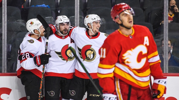 Senators upset Flames in return from extended break