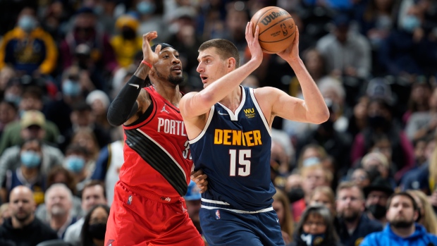 Robert Covington and Nikola Jokic, The Canadian Press Robert Covington and Nikola Jokic